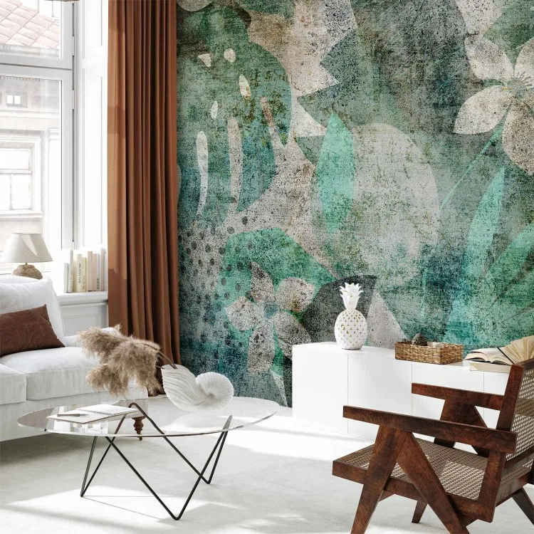 Peinture murale végétale - des feuilles sur un fond textile gris imitant le béton 